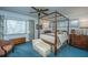 Charming bedroom with a four-poster bed, window, and vintage furniture at 46 Chadwick Dr, Charleston, SC 29407