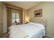 Serene bedroom with a tufted headboard and a cozy knit blanket at 46 Chadwick Dr, Charleston, SC 29407