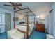 Spacious bedroom with four-poster bed, ample natural light, and vintage furniture at 46 Chadwick Dr, Charleston, SC 29407