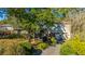 Attractive light beige two-story home with mature landscaping and attached garage at 46 Chadwick Dr, Charleston, SC 29407