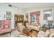 Elegant living room with hardwood floors, antique furniture, and large windows at 46 Chadwick Dr, Charleston, SC 29407