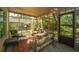 Cozy screened porch with seating area and views at 46 Chadwick Dr, Charleston, SC 29407