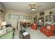 Inviting sitting area with two armchairs, a desk, and a ceiling fan at 46 Chadwick Dr, Charleston, SC 29407