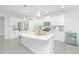 Modern kitchen with white cabinets and large island at 5017 Cranesbill Way, Johns Island, SC 29455