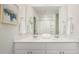 Double vanity bathroom with large mirror and white cabinets at 503 Frutchey Ct, Summerville, SC 29486