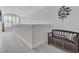 Upstairs hallway with window and storage bench at 539 Pontoon Rd, Huger, SC 29450