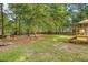 Spacious backyard with firepit and trees at 614 Deepwood Ct, Moncks Corner, SC 29461