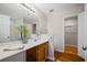 Clean bathroom with wood vanity and walk-in closet at 66 Creek Bend Dr, Summerville, SC 29485