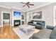 Living room with hardwood floors, fireplace, and comfortable seating at 8553 Refuge Pointe Cir, Charleston, SC 29420