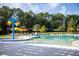 Relaxing pool area with multiple lounge chairs and umbrellas at 956 Carnes Xing, Goose Creek, SC 29445