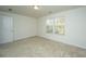 Empty bedroom with neutral carpet, white walls, and windows with blinds at 104 Elliott Creek Ln, Summerville, SC 29485