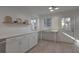 Modern kitchen with white cabinets, quartz countertops and breakfast bar at 104 Lewisfield Dr, North Charleston, SC 29418