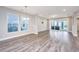 Open living room and kitchen area with gray wood-look floors at 113 Winding Branch Dr, Summerville, SC 29486