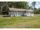 Newly renovated gray house with white trim, front porch, and landscaped yard at 118 Backhall Rd, Saint Stephen, SC 29479