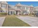 Two-story townhouses with neutral siding, gray roofs, and manicured lawns at 140 Black River Dr, Summerville, SC 29485