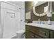 Updated bathroom with marble vanity, white subway tile, and dark green accents at 1432 River Front Dr, Charleston, SC 29407