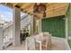 Covered outdoor dining area with wood accents and a green wall at 1475 Sheepshead Ln, Mount Pleasant, SC 29466