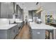 Modern kitchen with gray cabinets, a large island, and stainless steel appliances at 149 Low Tide Ct, Charleston, SC 29492