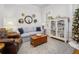 Cozy living room with light gray sofa, wooden coffee table, and decorative mirrors at 1713 Doldridge St, Charleston, SC 29492