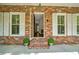 Inviting front entrance with brick facade and white shutters at 200 Nantucket Dr, Summerville, SC 29485