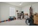 Versatile bedroom with home gym equipment, rocking chair, and ample shelving at 2050 Rondo St # A, Charleston, SC 29414