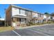 Brick townhouse exterior with parking and landscaping at 2050 Rondo St # A, Charleston, SC 29414