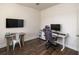 Dedicated workspace with wall-mounted TV, desk, and ergonomic chair at 215 Bering Ln, Summerville, SC 29486