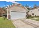 Attached garage with white door and stone accents at 249 Austin Creek Ct, Summerville, SC 29483