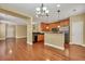 Open concept kitchen features hardwood floors and a breakfast bar at 249 Austin Creek Ct, Summerville, SC 29483