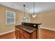 Kitchen island with dark countertop and hardwood floors at 249 Austin Creek Ct, Summerville, SC 29483