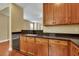 Kitchen with dark countertops, sink, and wood cabinets at 249 Austin Creek Ct, Summerville, SC 29483