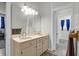 Double vanity bathroom with marble countertops and decorative accents at 2514 Myrtle Ave, Sullivans Island, SC 29482