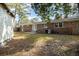 Backyard view of brick home with shed and patio at 301 Corey Blvd, Summerville, SC 29483