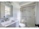 Clean bathroom with vanity, shower, and window at 301 Corey Blvd, Summerville, SC 29483