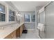 Updated bathroom with double vanity, marble floors, and a shower at 301 Corey Blvd, Summerville, SC 29483