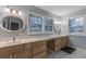 Double vanity bathroom with wood cabinets and marble flooring at 301 Corey Blvd, Summerville, SC 29483