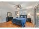 Bright bedroom with wood floors, double windows, and sliding glass doors at 301 Corey Blvd, Summerville, SC 29483