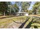 Ranch house with mature trees and driveway at 301 Corey Blvd, Summerville, SC 29483