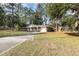 Brick ranch house with attached garage and large yard at 301 Corey Blvd, Summerville, SC 29483