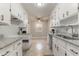 Kitchen with white cabinets, granite counters, and tile floor at 301 Corey Blvd, Summerville, SC 29483