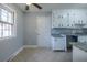 Kitchen with white cabinets, granite counters, and tile floor at 301 Corey Blvd, Summerville, SC 29483