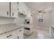 Kitchen with white cabinets, granite counters, and tile floor at 301 Corey Blvd, Summerville, SC 29483
