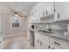 Kitchen with white cabinets, granite counters, and tile floor at 301 Corey Blvd, Summerville, SC 29483