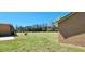 Spacious backyard with large grassy area and mature trees at 3112 Santee River Rd, Saint Stephen, SC 29479