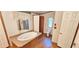 Relaxing bathroom with soaking tub, toilet and wood-look flooring at 3112 Santee River Rd, Saint Stephen, SC 29479