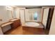 Bathroom with double sinks, a soaking tub and wood cabinets at 3112 Santee River Rd, Saint Stephen, SC 29479