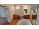 Bathroom boasts double sinks, a soaking tub, and wood cabinets at 3112 Santee River Rd, Saint Stephen, SC 29479