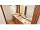 Double vanity bathroom with wood cabinets and flooring at 3112 Santee River Rd, Saint Stephen, SC 29479
