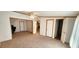 Large bedroom with access to other rooms and carpet flooring at 3112 Santee River Rd, Saint Stephen, SC 29479
