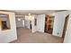 Bright dining area with a chandelier and views into the living room and kitchen at 3112 Santee River Rd, Saint Stephen, SC 29479